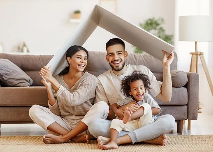 Happy family sitting in living room
